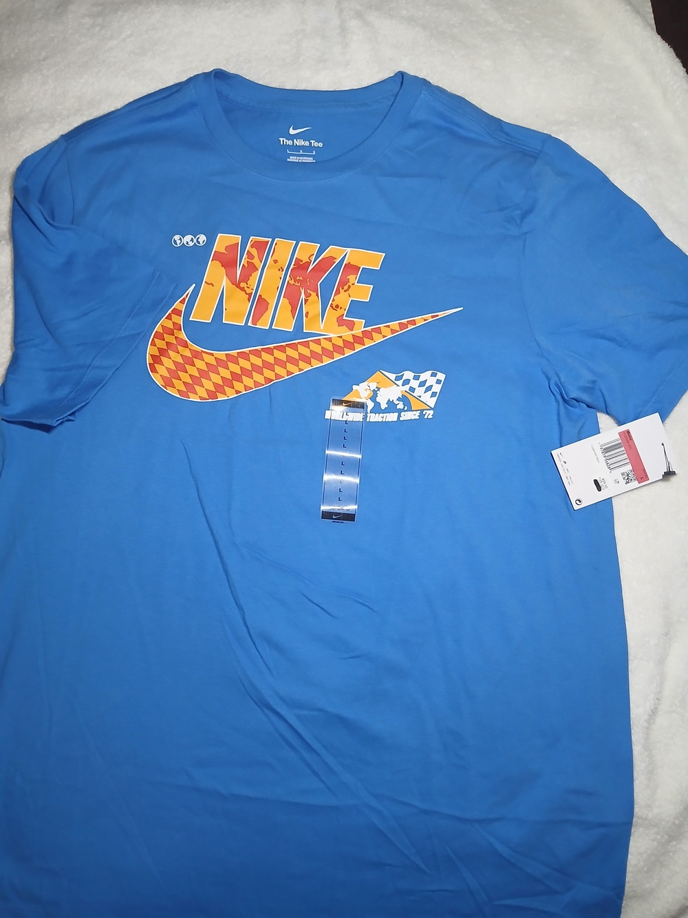 Nike Men’s Royal Blue Graphic Logo Tee with Orange Accents.Size L